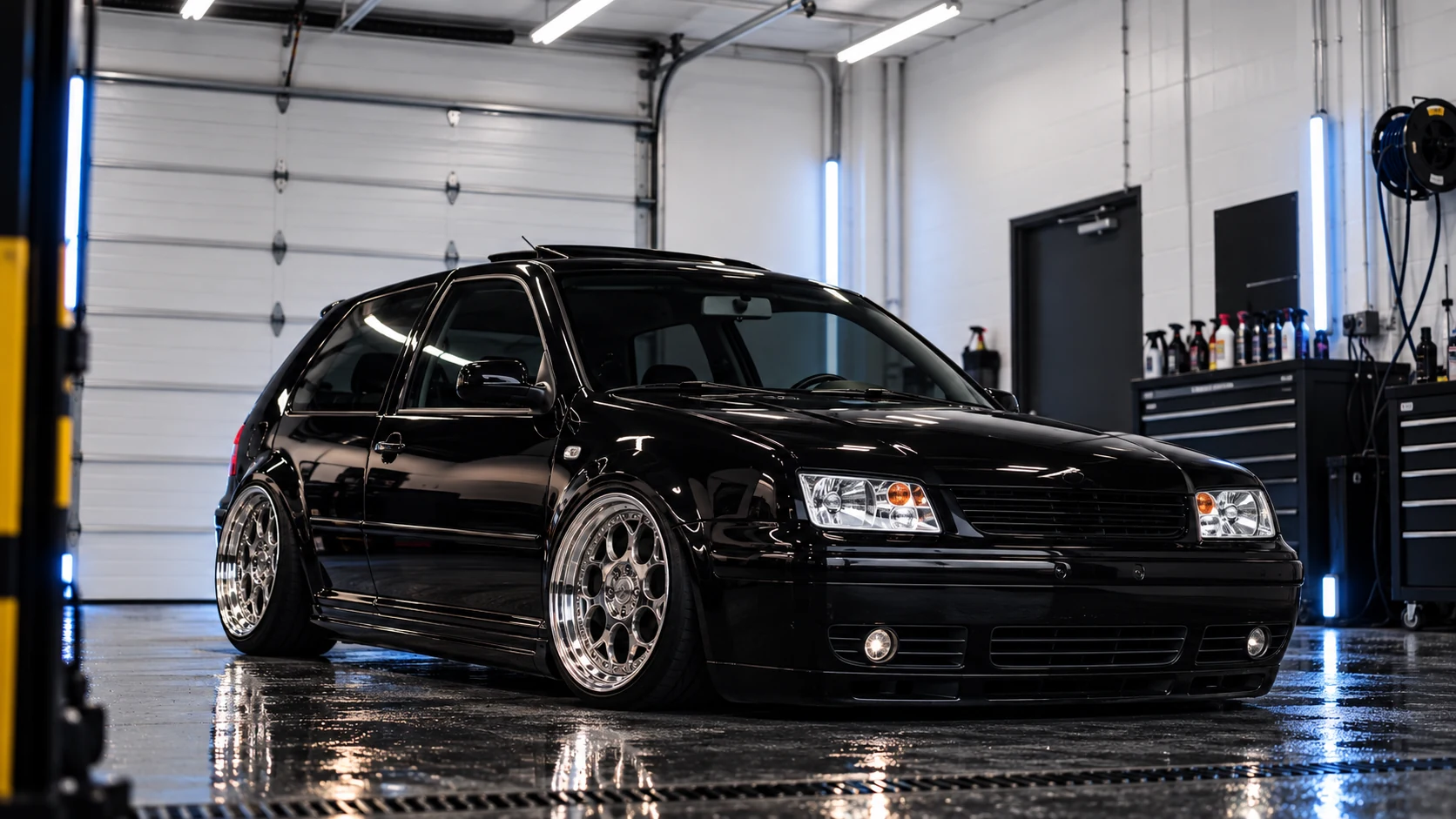 Black GTI after detailing shown from a front three-quarter angle with deep gloss
